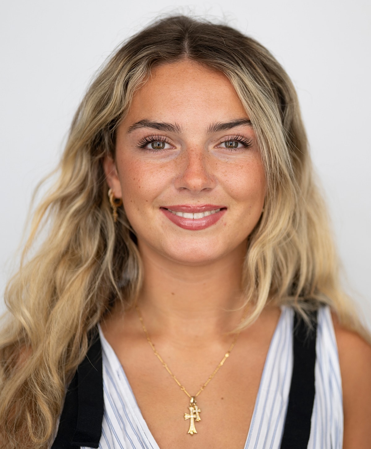 Portrait of a smiling young Smiling Kalispell acne treatment model with jewelry.