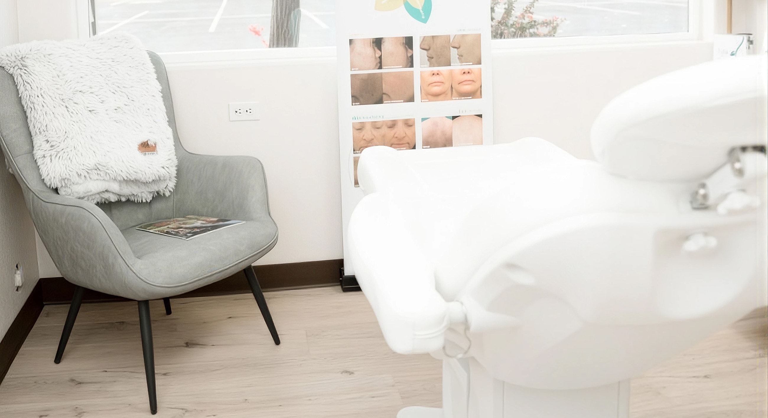 Spa treatment room with chair and aesthetic display.