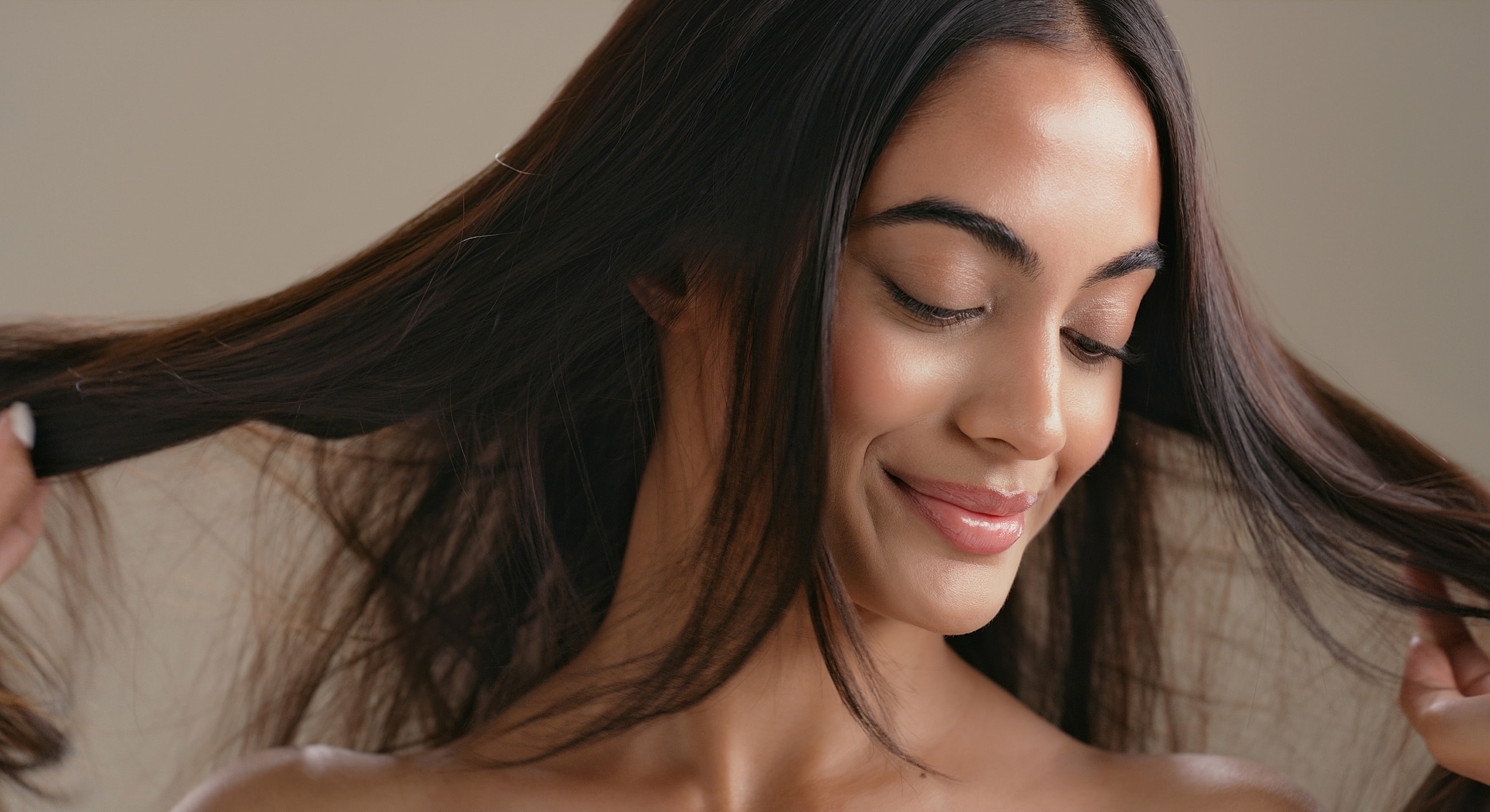 Woman enjoying her long, healthy hair.