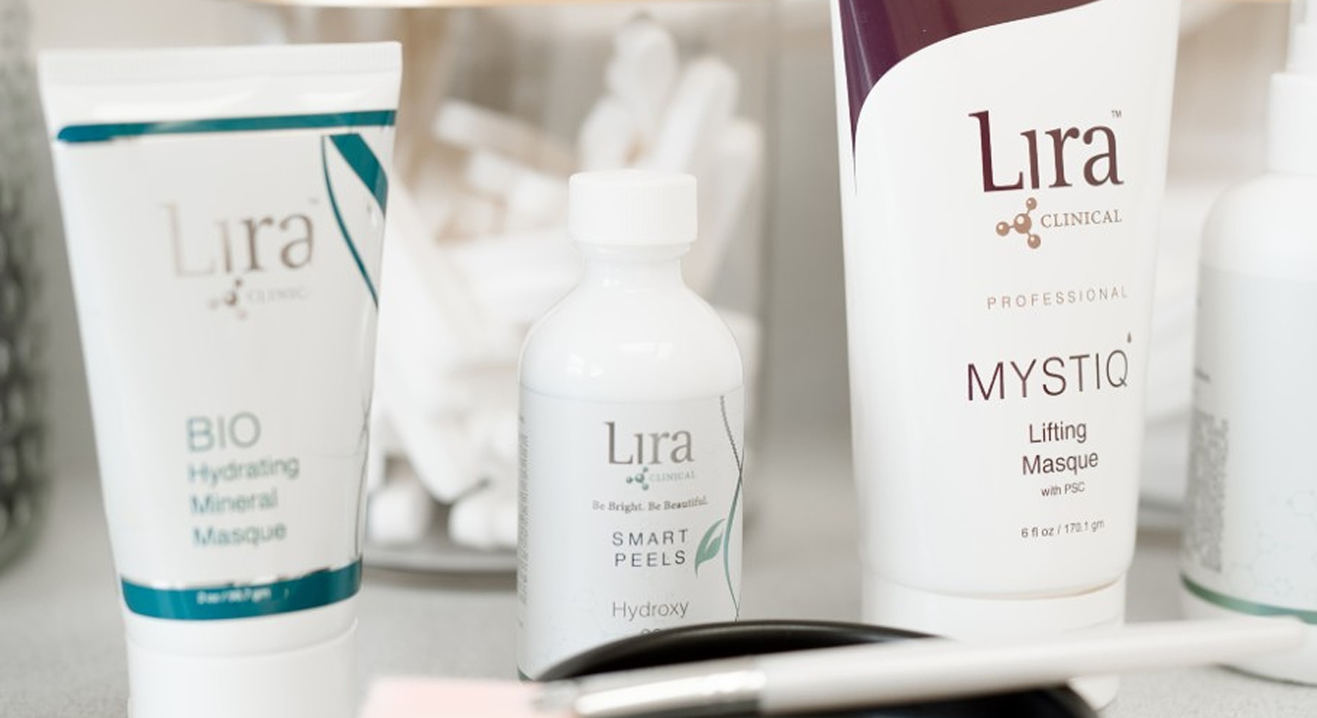 Lira Clinical skincare products on countertop.